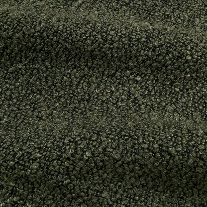 Close-up of dark forest green boucle fabric texture with woven looped fibres