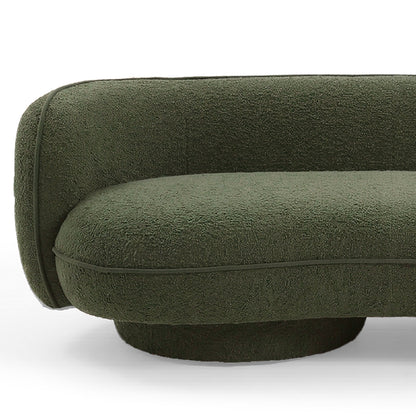 Dark forest green boucle 3 seater sofa with curved armrest and rounded base on white background