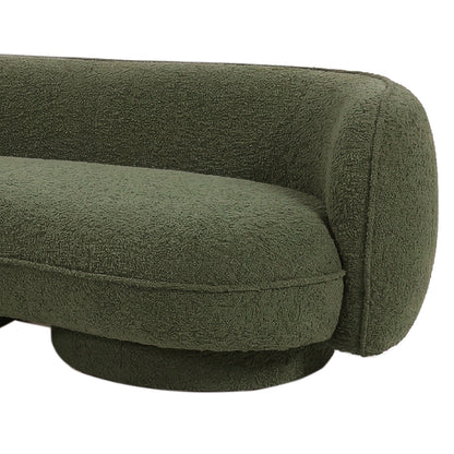 Green boucle curved sofa with rounded arms and textured upholstery