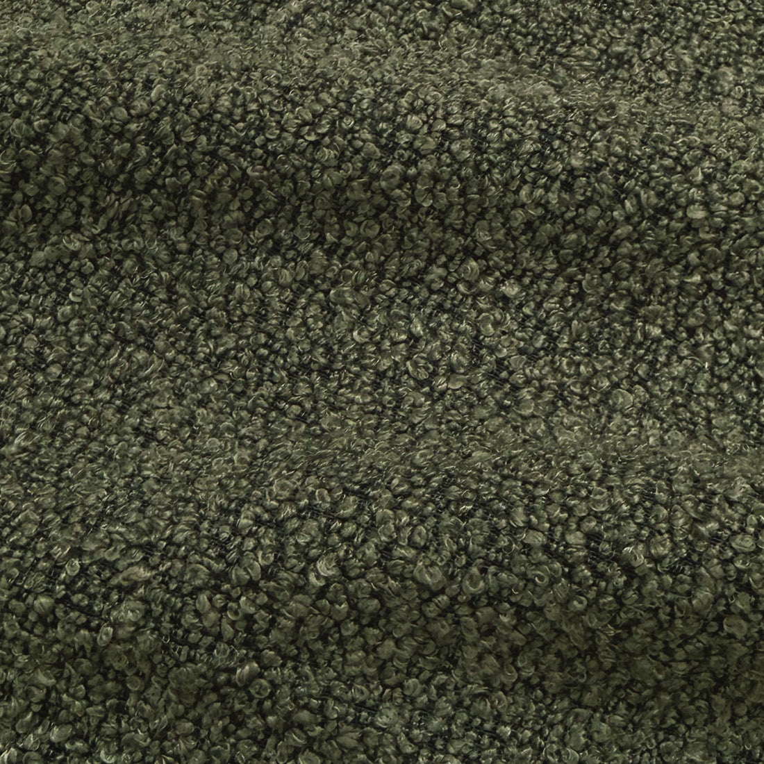 Close-up of dark forest green performance boucle fabric texture