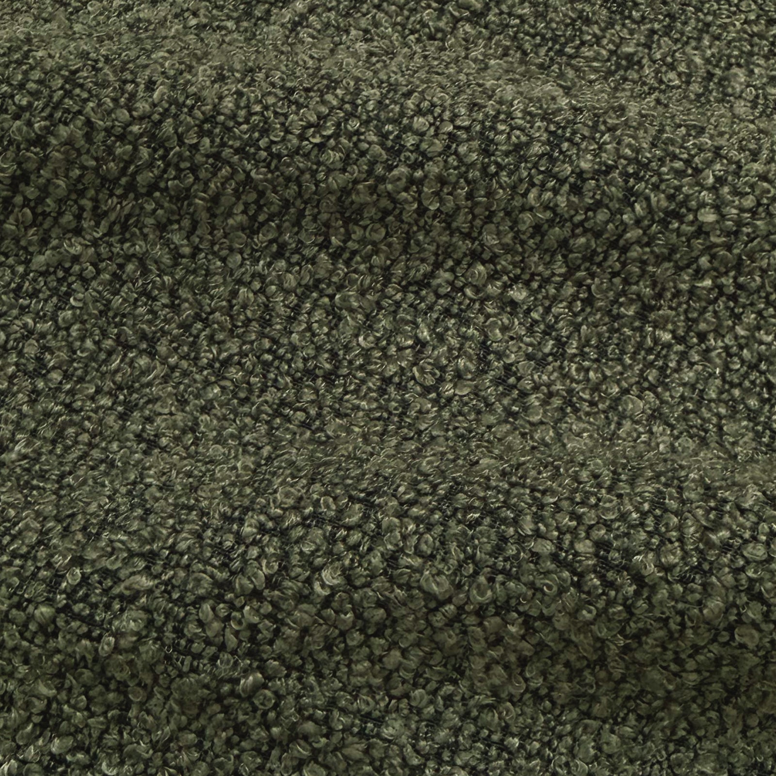 Close-up of dark forest green performance boucle fabric texture