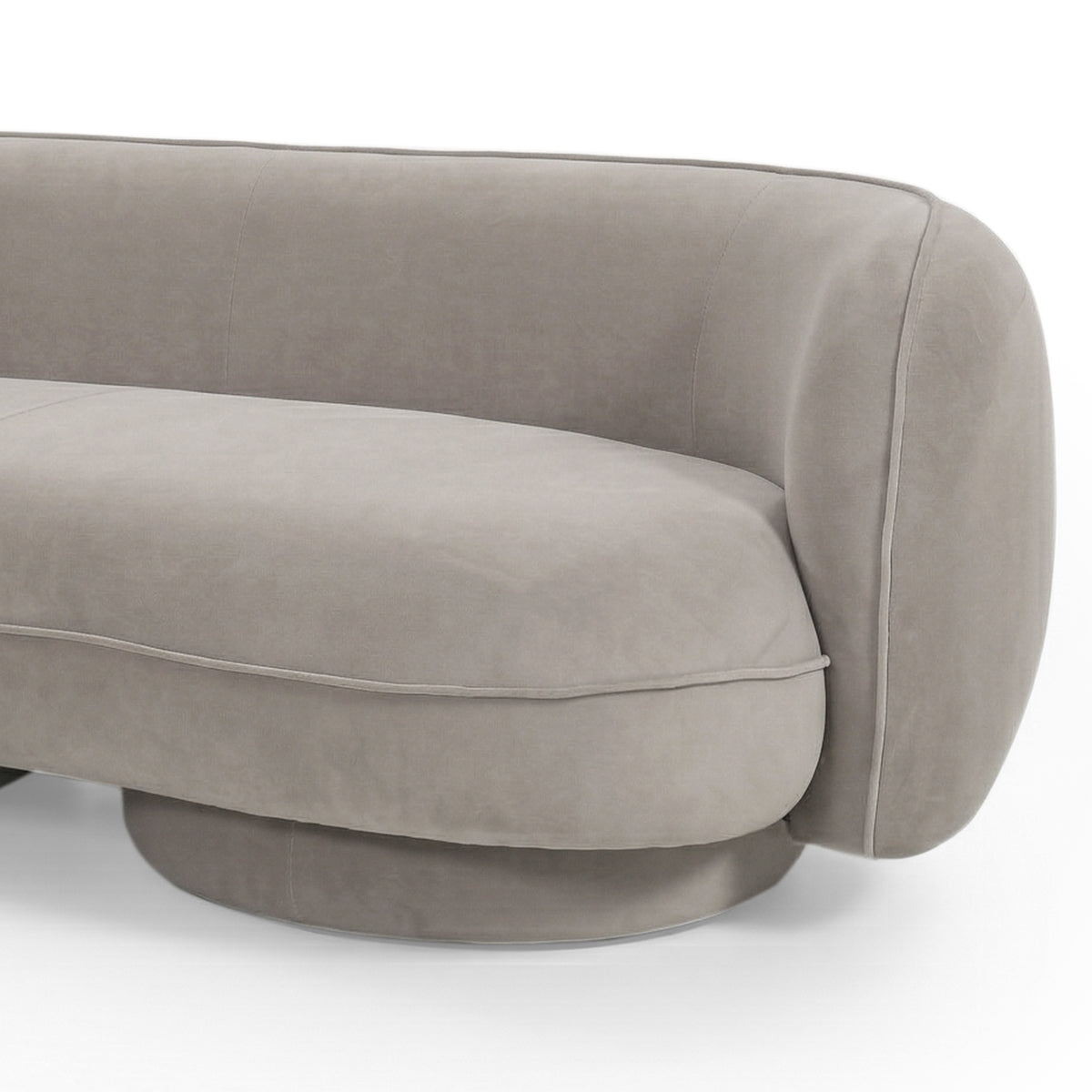 Close-up of curved armrest and cushioned seat of Torven 3 seater performance velvet sofa in warm beige with rounded base