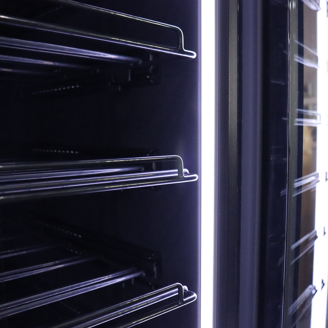 VinoVault 155 Bottle Built-In Single Zone Wine Fridge – Black, featuring a sleek black tempered glass door with a door-mounted touchscreen, showcasing its spacious interior for 155 bottles and customizable lighting.