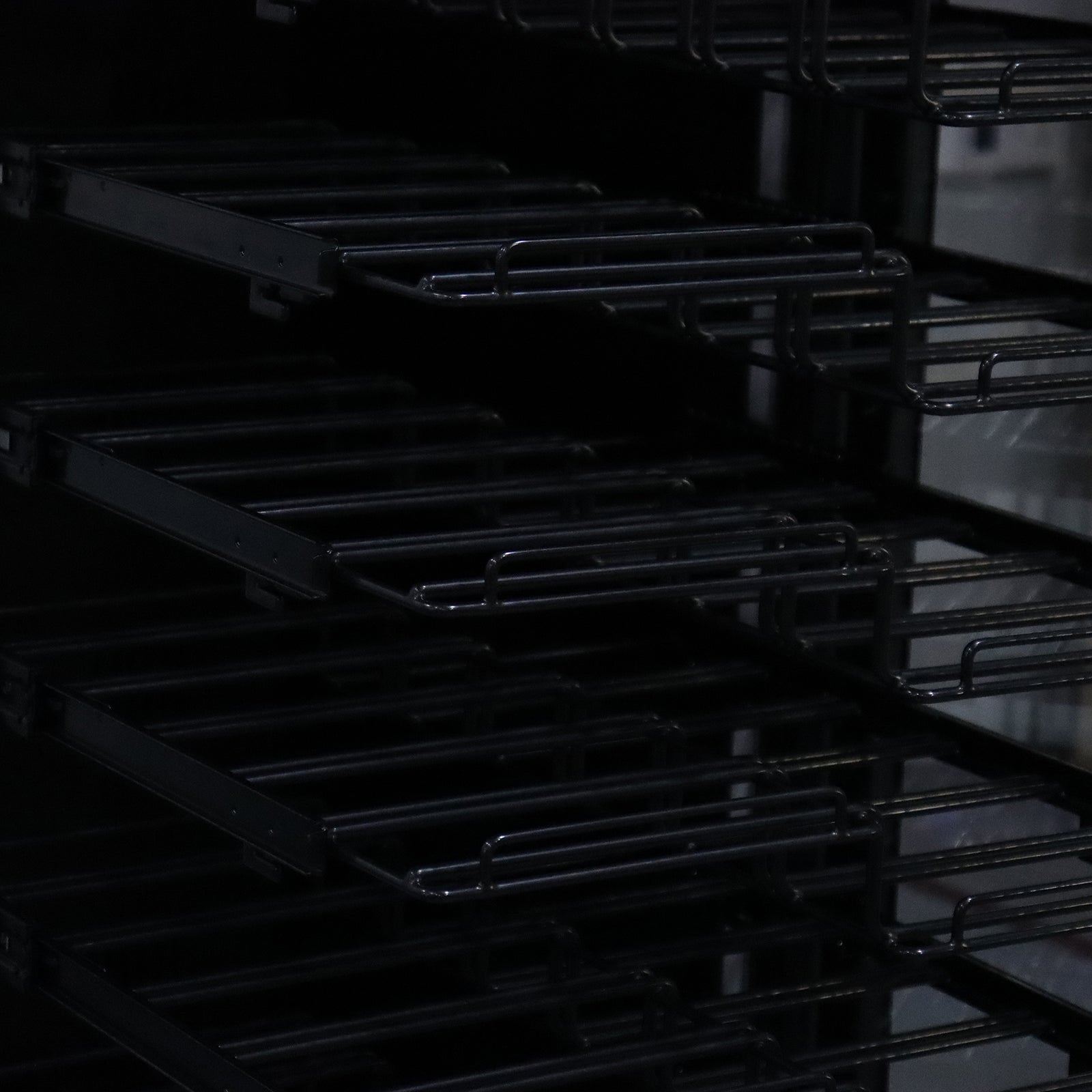 VinoVault 155 Bottle Built-In Single Zone Wine Fridge – Black; features sleek black tempered glass with chrome finishes, customizable LED lighting, and visible telescopic shelves for optimal wine display and storage.