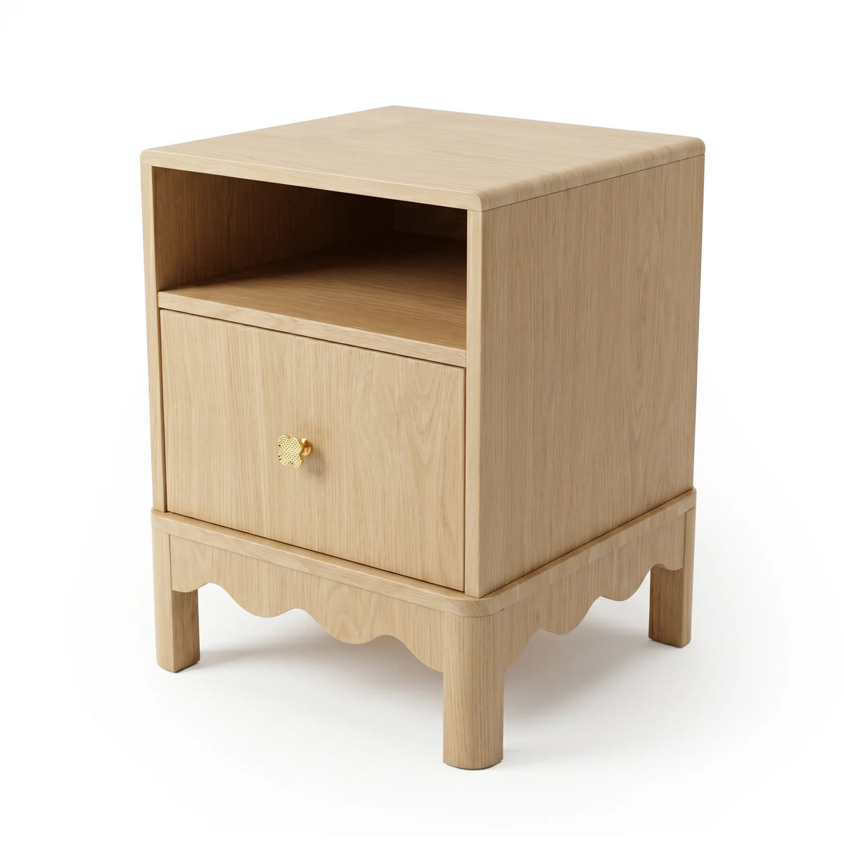 A light oak bedside table featuring an open shelf, a single drawer with a gold flower-shaped knob, and a scalloped base detail.