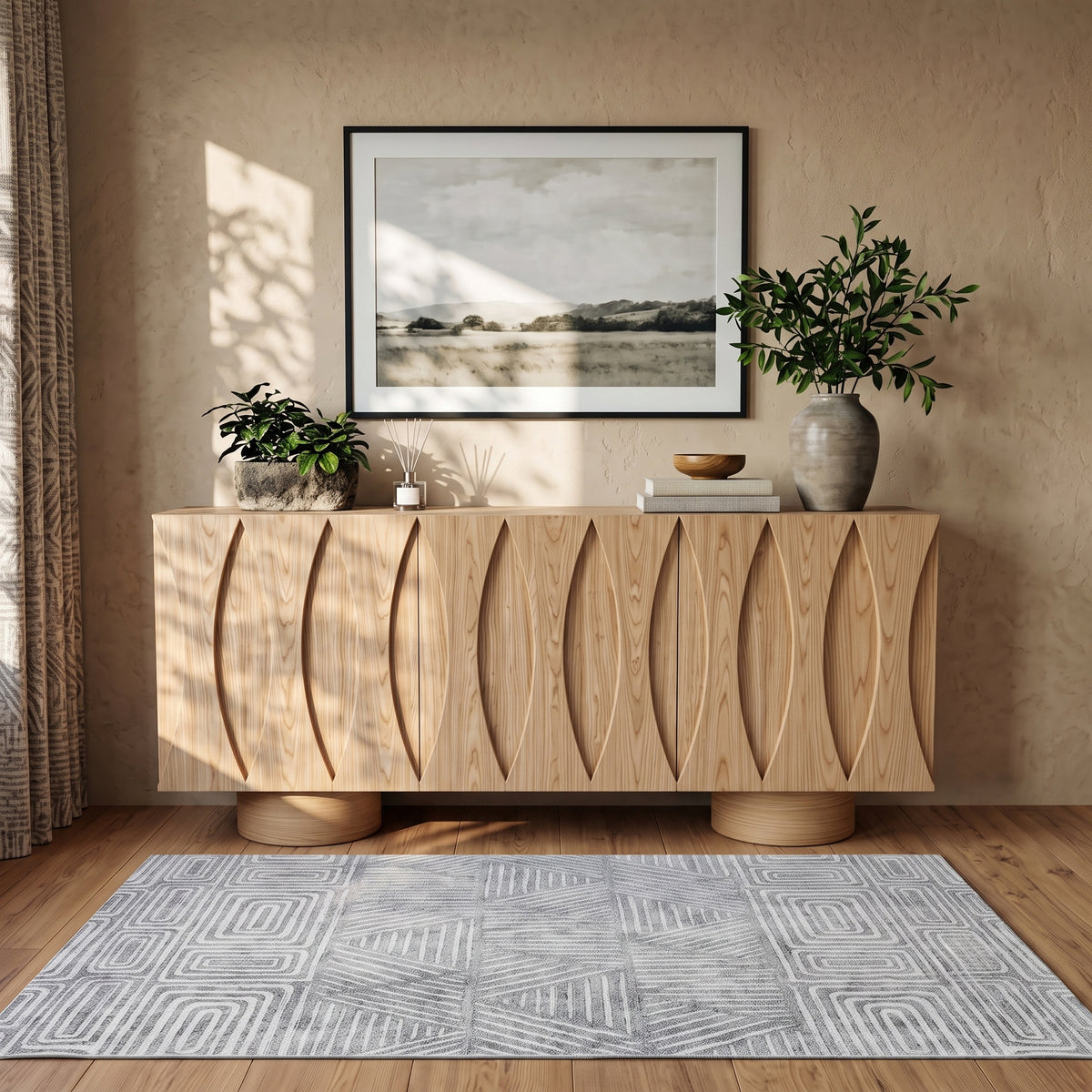 Wooden sideboard styled in a cozy room with decor and sunlight