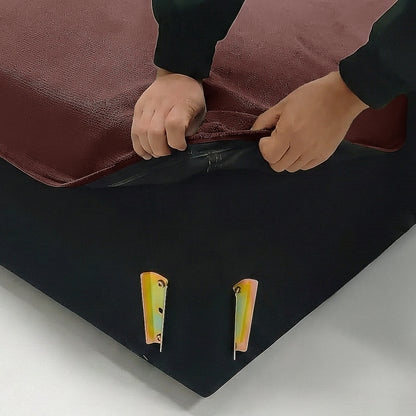 Hands lifting sofa fabric cover corner