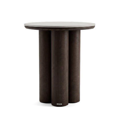 Round dark wood side table with three cylindrical legs on a white background