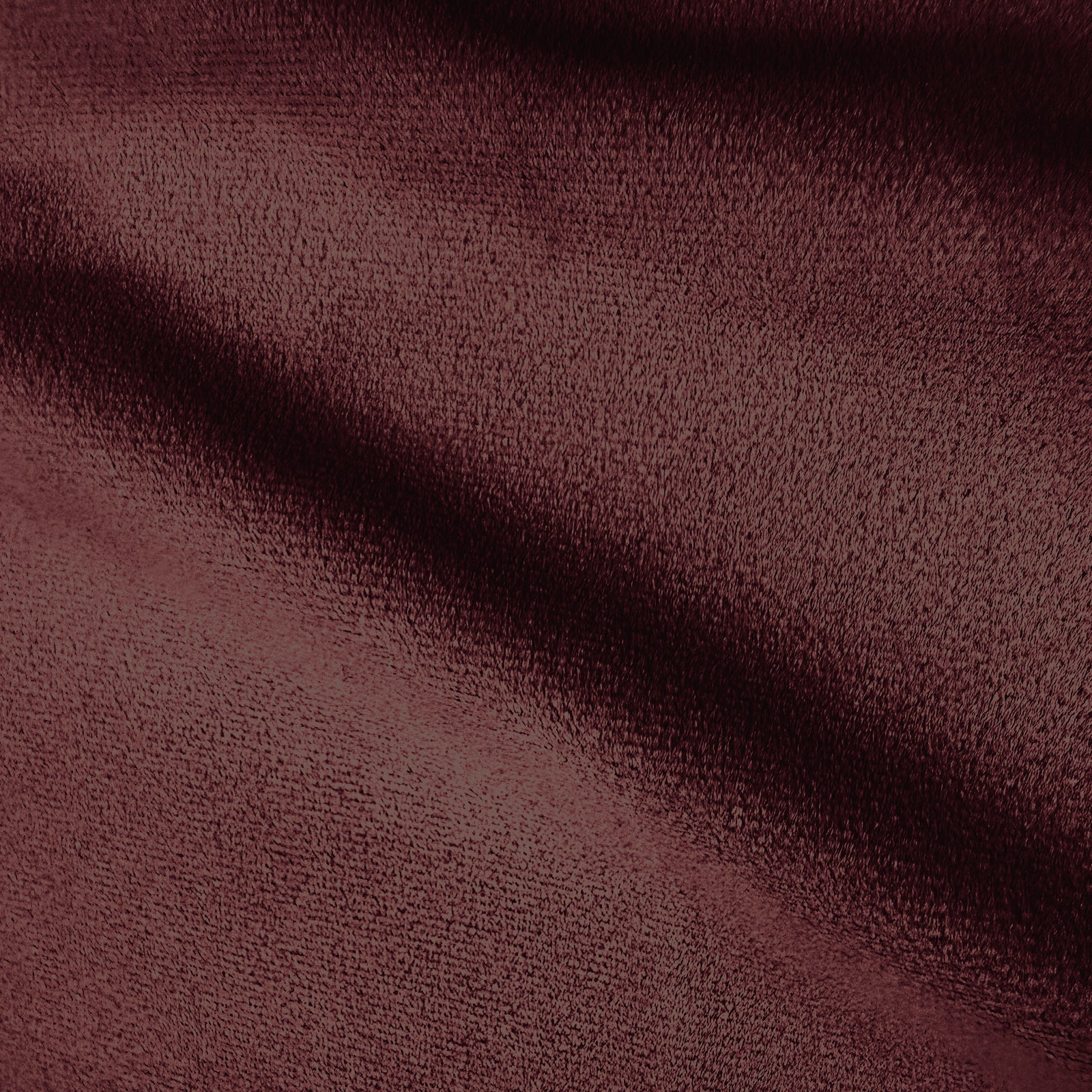 Extreme close-up of burgundy upholstery fabric texture