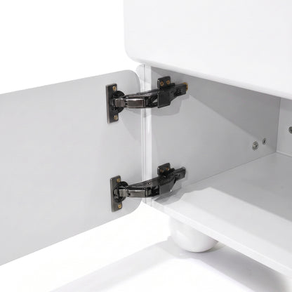 Close-up of cabinet interior with concealed hinges on a white furniture piece