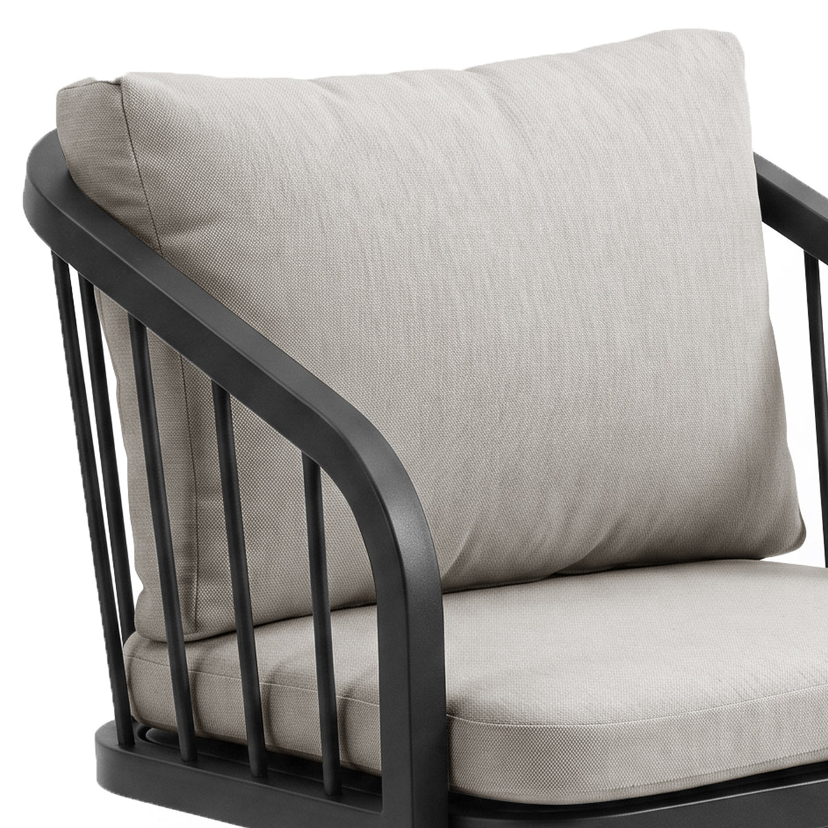 Close-up of chair arm and cushions on white background