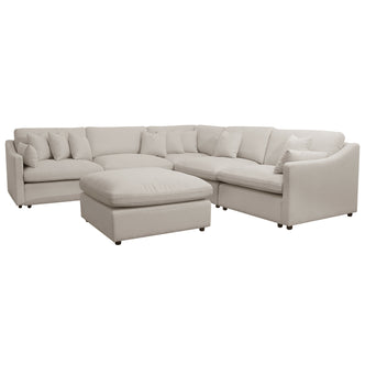 Light beige sectional sofa with matching ottoman on a white background