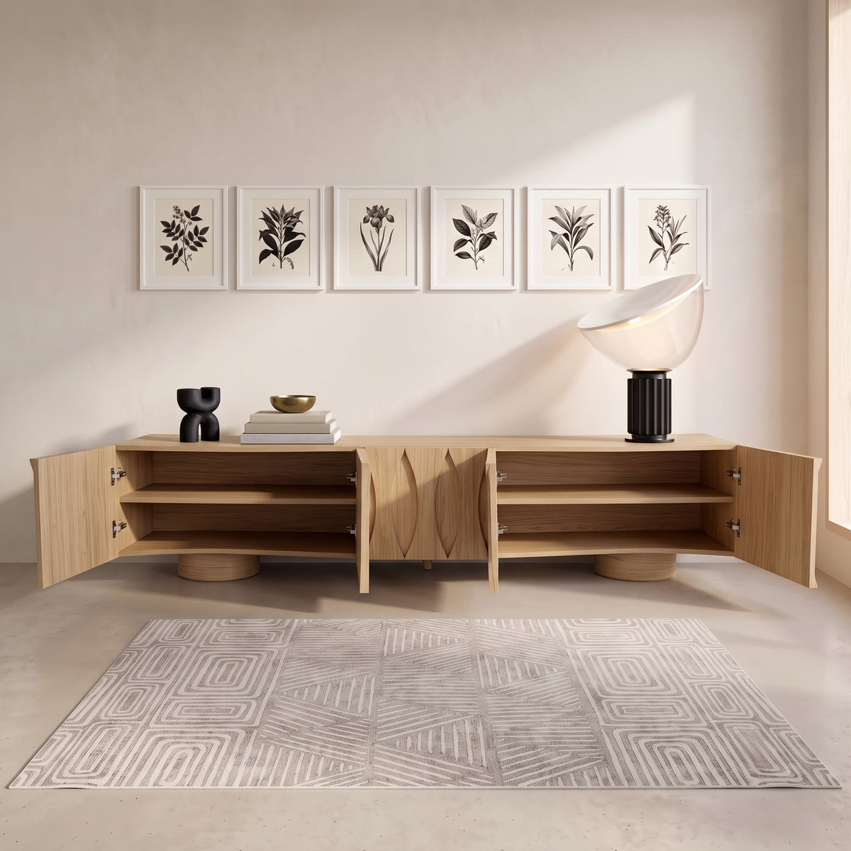 Wooden media console styled in a minimalist room with artwork and decor
