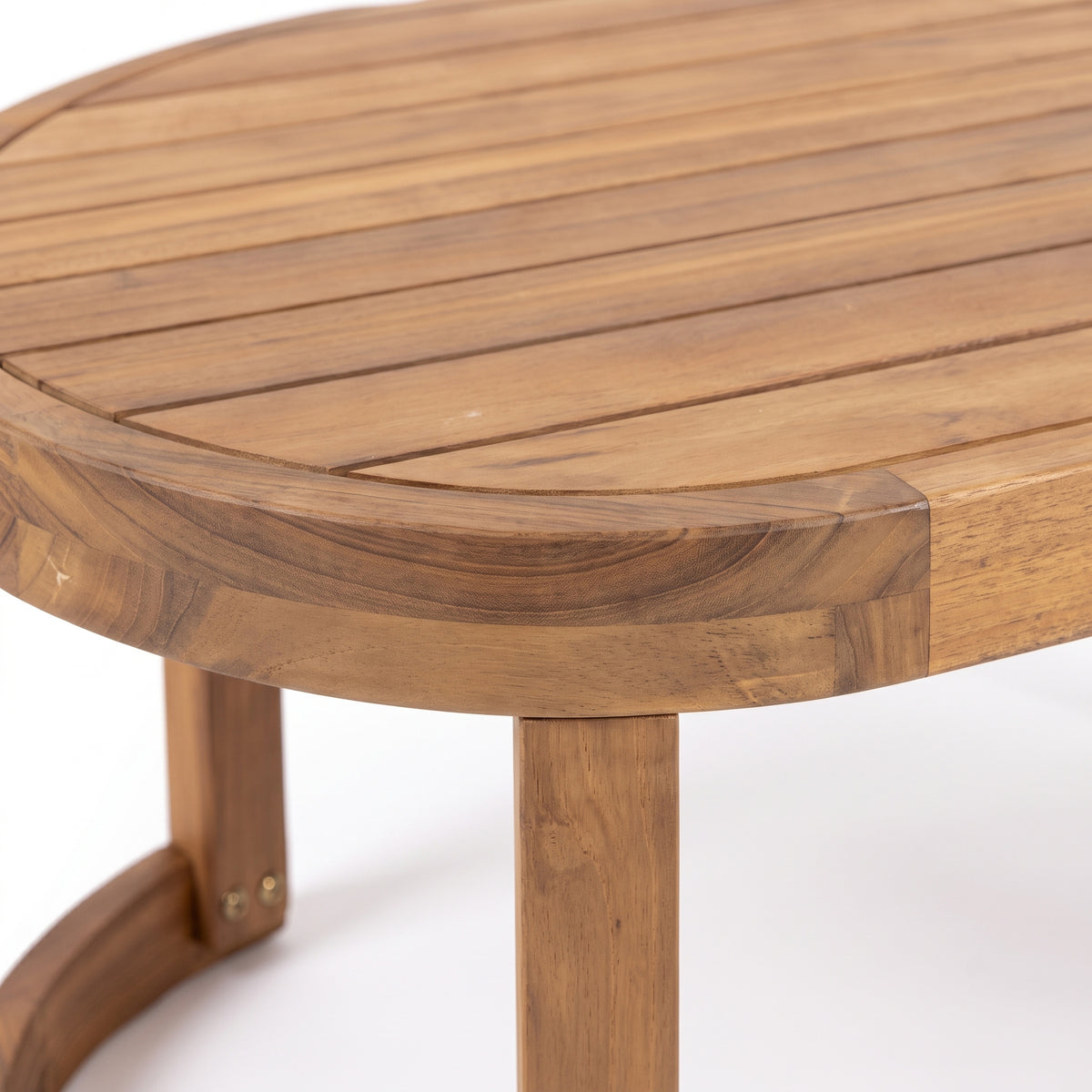 Close-up of wooden table edge and legs on white background