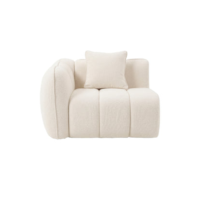 Cream-colored corner section of a modular sofa with plush cushion on white background