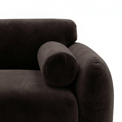 Close-up of dark brown sofa armrest and cushion detail on white background