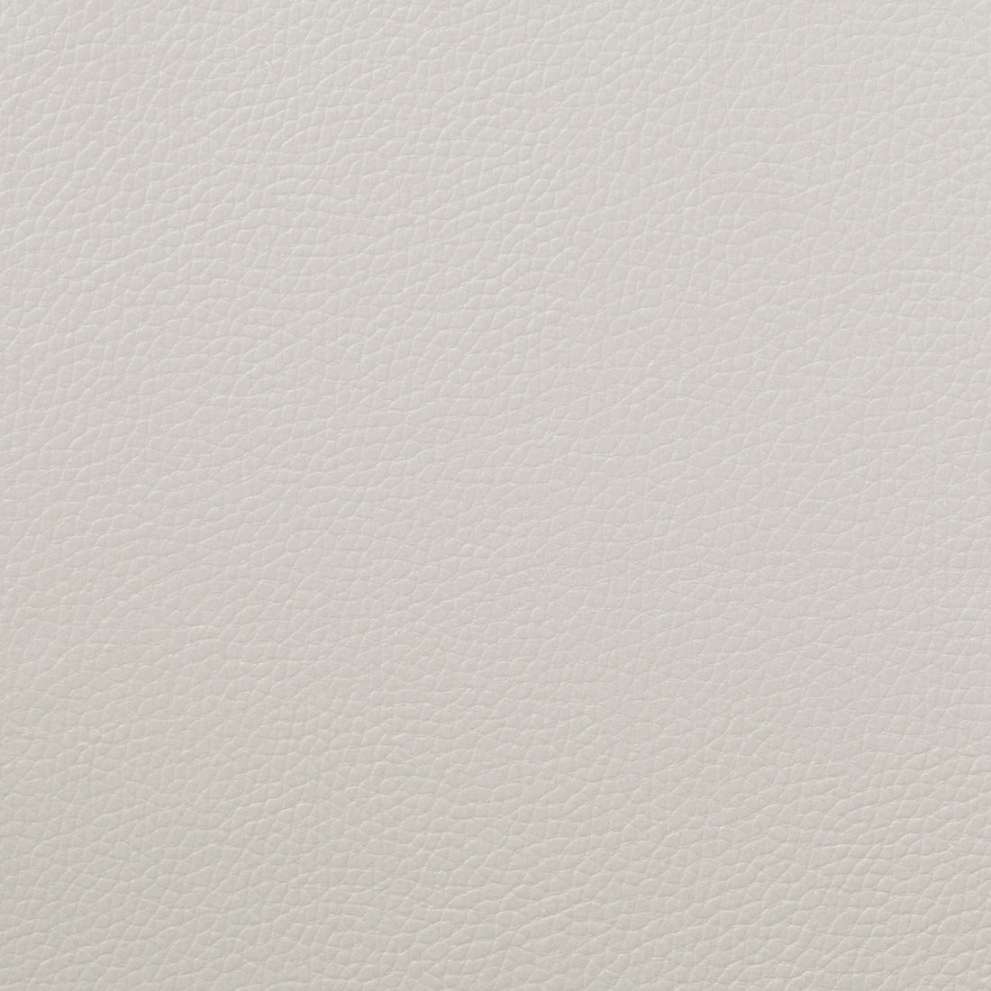 Close-up of beige upholstery texture.