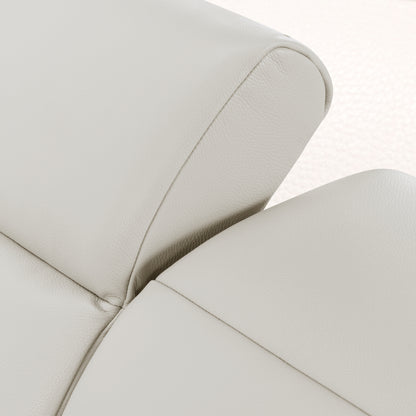 Close-up of light beige upholstered furniture with visible stitching and texture