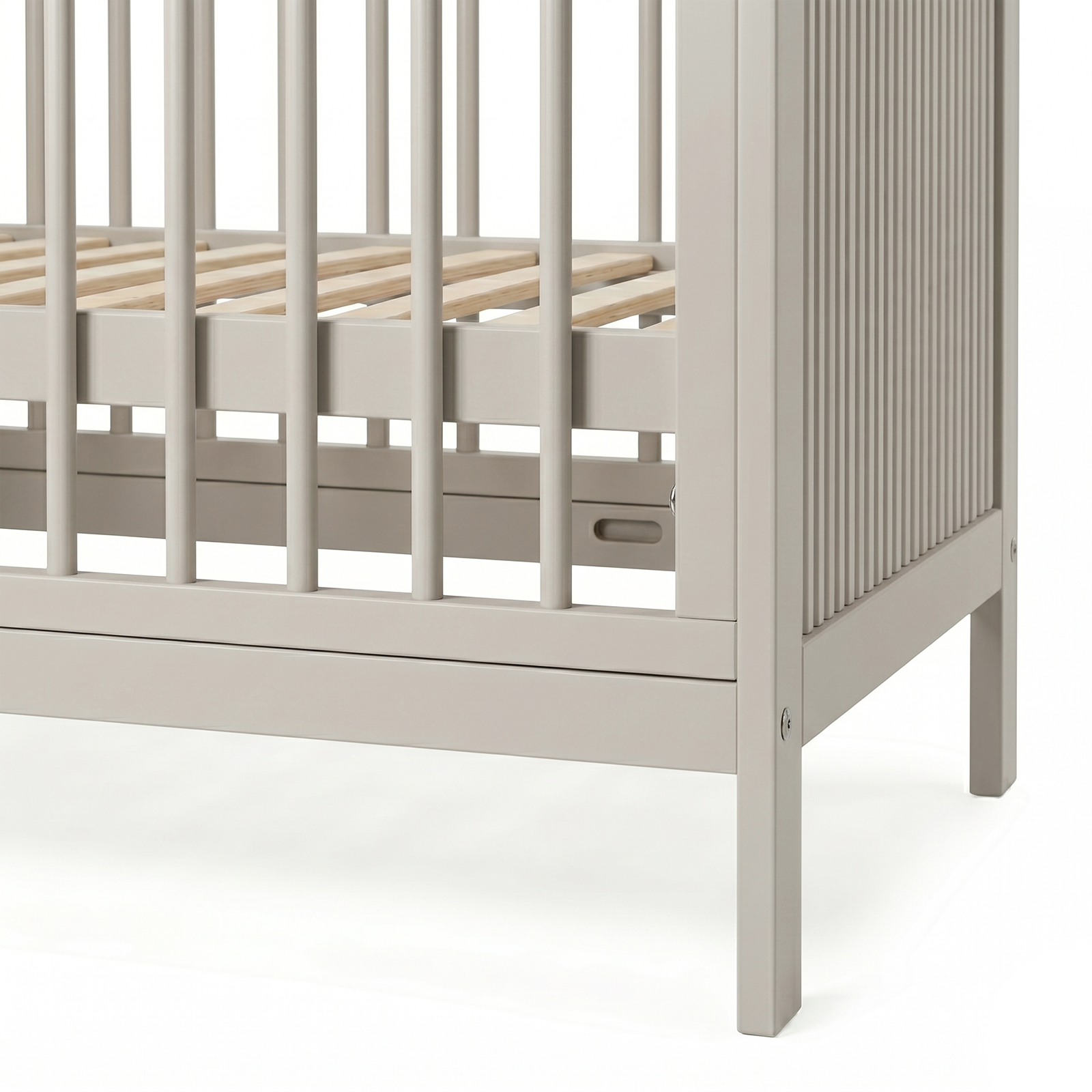 Detail of lower rails and legs of gray crib on white background