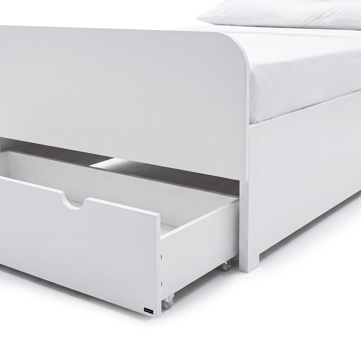 Close-up of the lower section of a white bed frame with an open storage drawer.