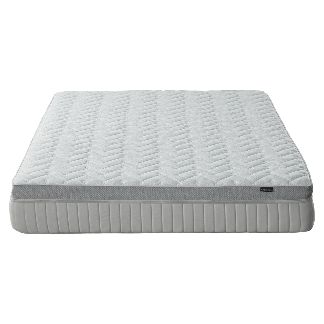 Mattress on white background shown nearly in full from a low angle
