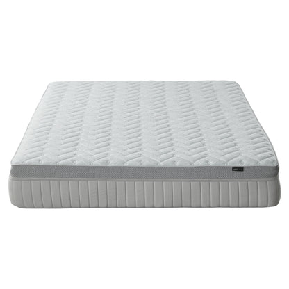 Mattress on white background shown nearly in full from a low angle