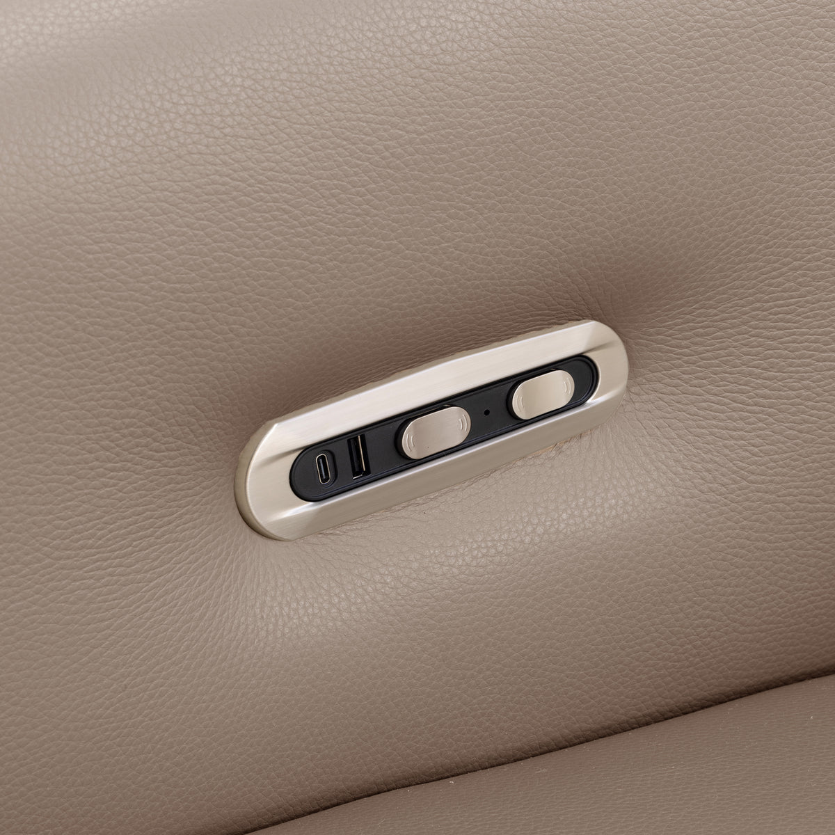 Close-up of a beige upholstered control panel with buttons and USB port