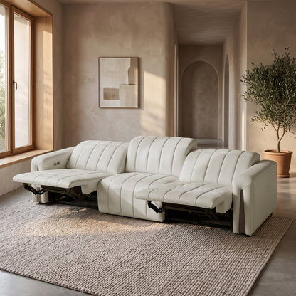 Modern beige reclining sofa in a styled living room.