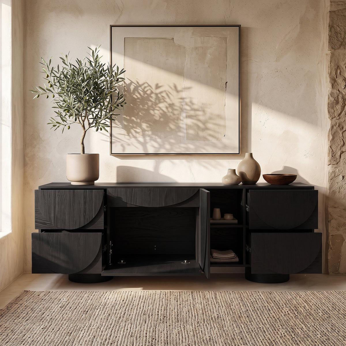 Contemporary black sideboard styled in a warm neutral interior