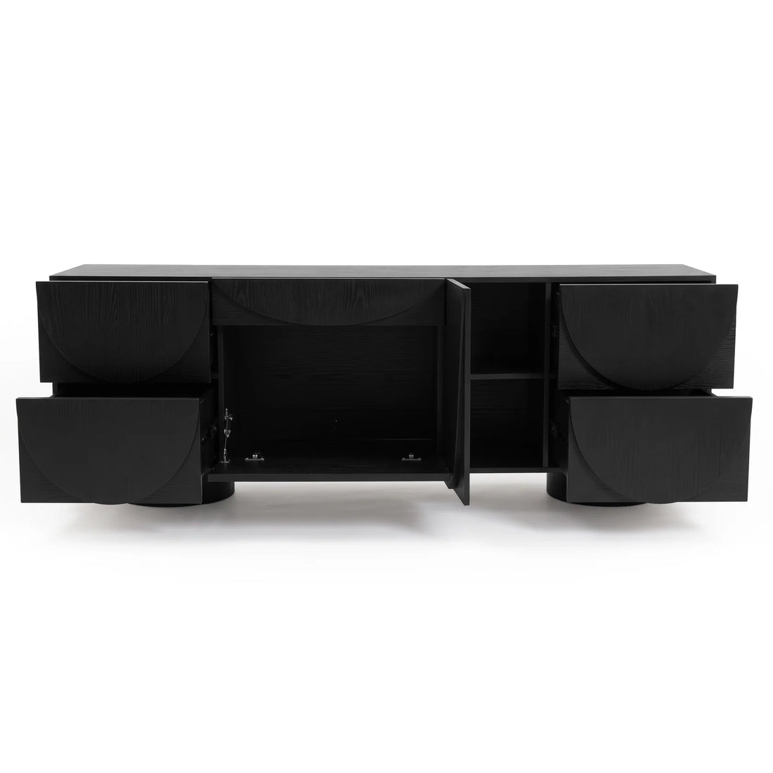 Black timber sideboard with open drawers and doors displaying carved semi-circle patterns against a plain white studio background