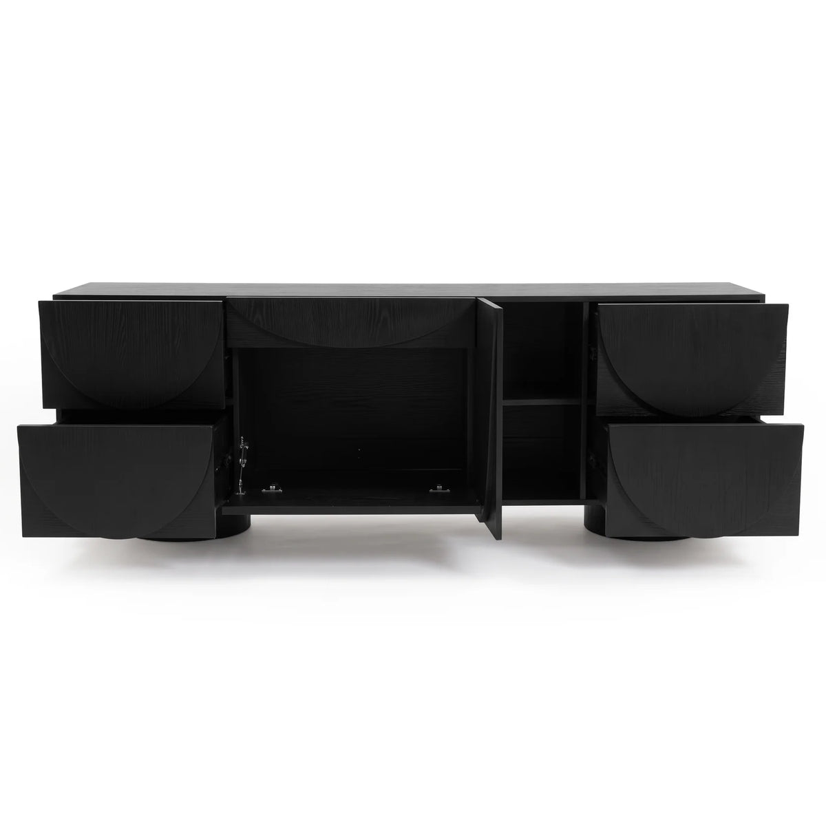 Black timber sideboard with open drawers and doors displaying carved semi-circle patterns against a plain white studio background