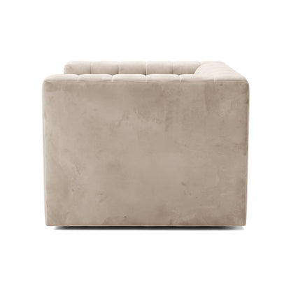 Partial side view of a beige sofa on a white background