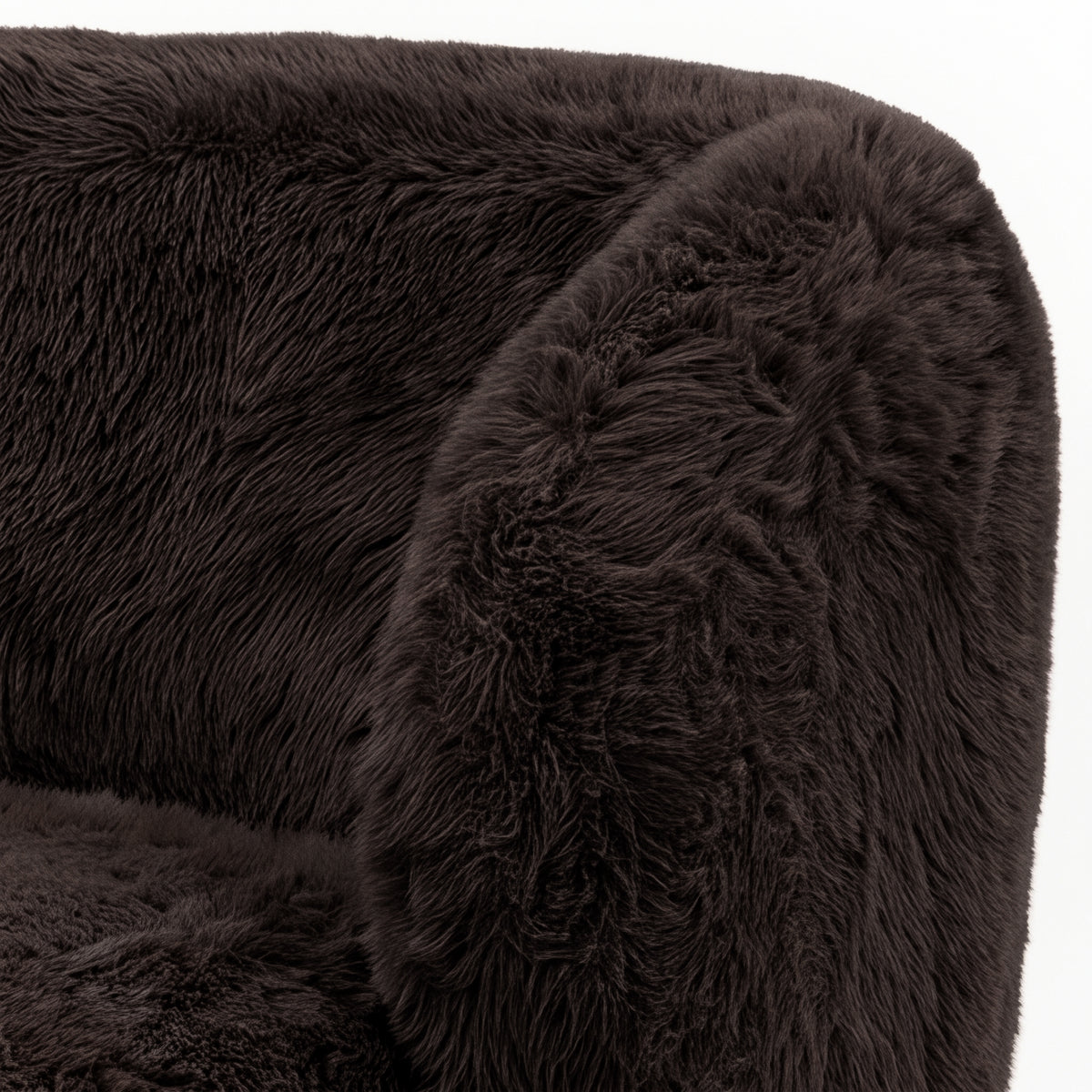 Close-up of a chocolate brown faux fur upholstered accent chair section on a white background