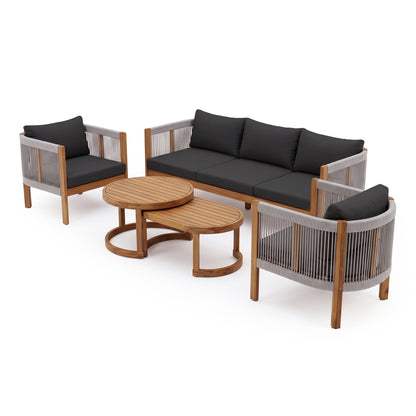 Complete outdoor furniture set with sofa, armchairs, and nesting coffee tables on white background