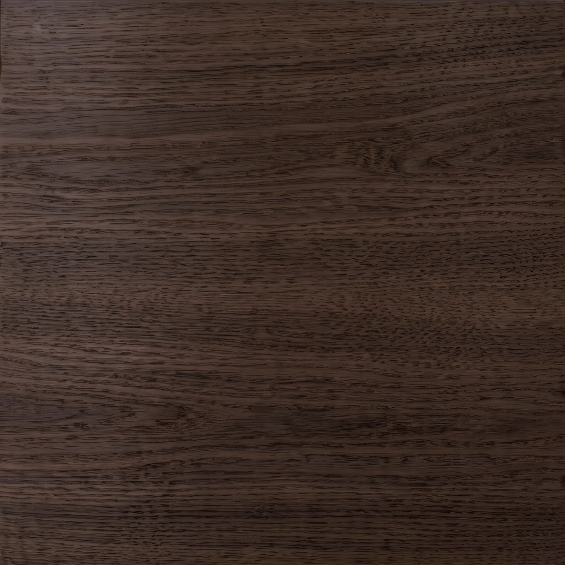 Close-up of dark brown wood grain surface detail.