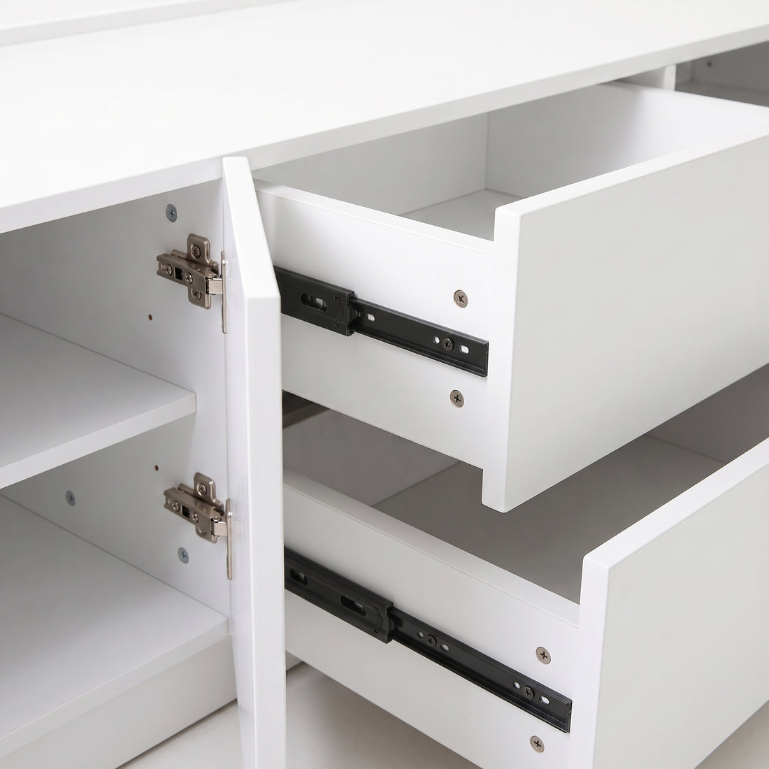 Close-up of open drawers and cabinet door on a white background