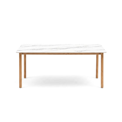 Rectangular dining table with white marble-patterned top and wooden legs on a white background