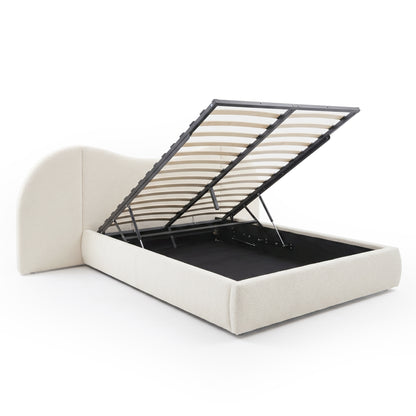 Upholstered storage bed with lifted mattress platform showing storage compartment on white background