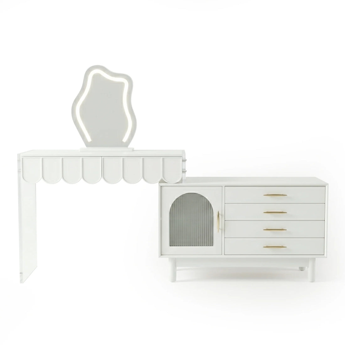 A modern white vanity set with a scalloped-edge table, a uniquely shaped illuminated mirror, and a side cabinet featuring a ribbed glass door and four drawers with gold pulls.