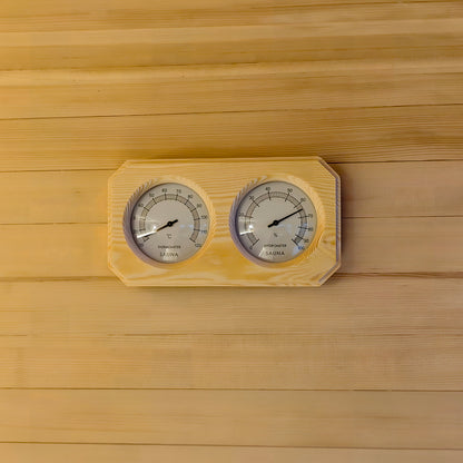 Wooden sauna thermometer and hygrometer on a wood wall