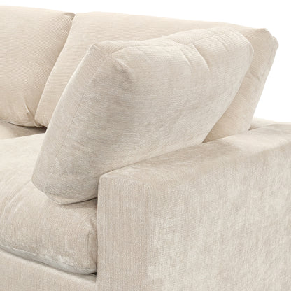 Close-up of beige sofa corner and cushions on white background