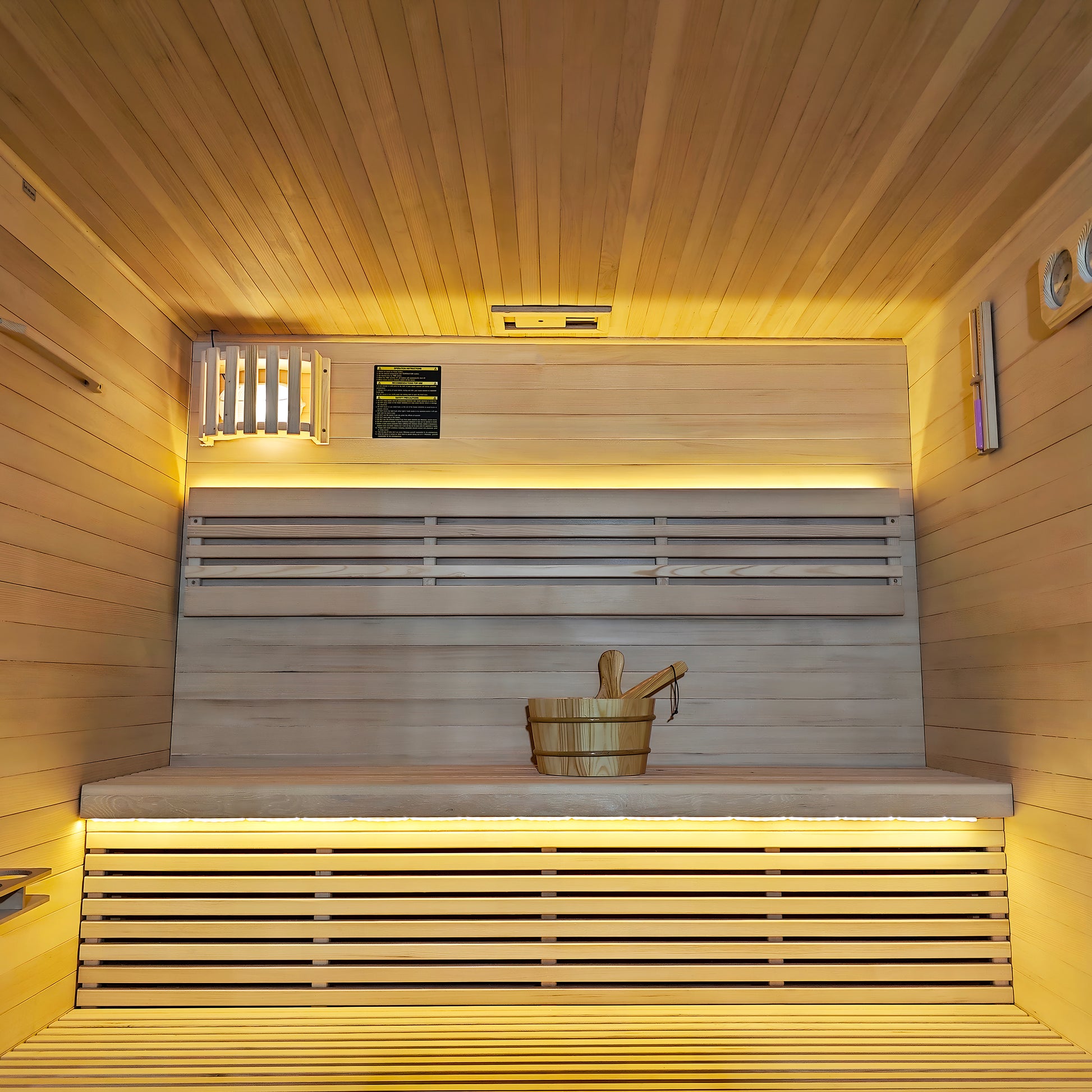 Interior view of a modern wooden sauna with warm lighting