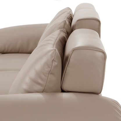 Angled partial view of a beige leather sofa on a white background