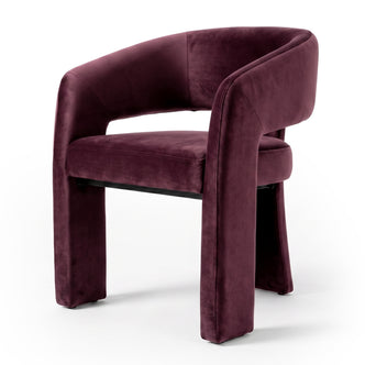 Full modern plum velvet accent chair on a white background