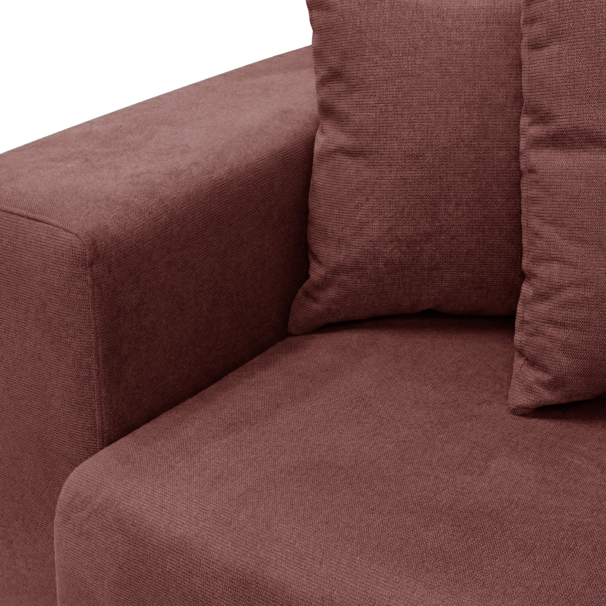 Corner of plush sofa with cushions on white