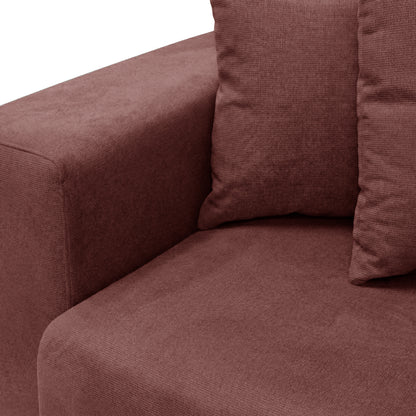 Corner of plush sofa with cushions on white