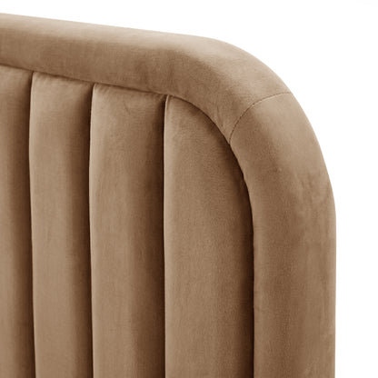 Detail close-up of tan velvet upholstery and channel tufting on a white background