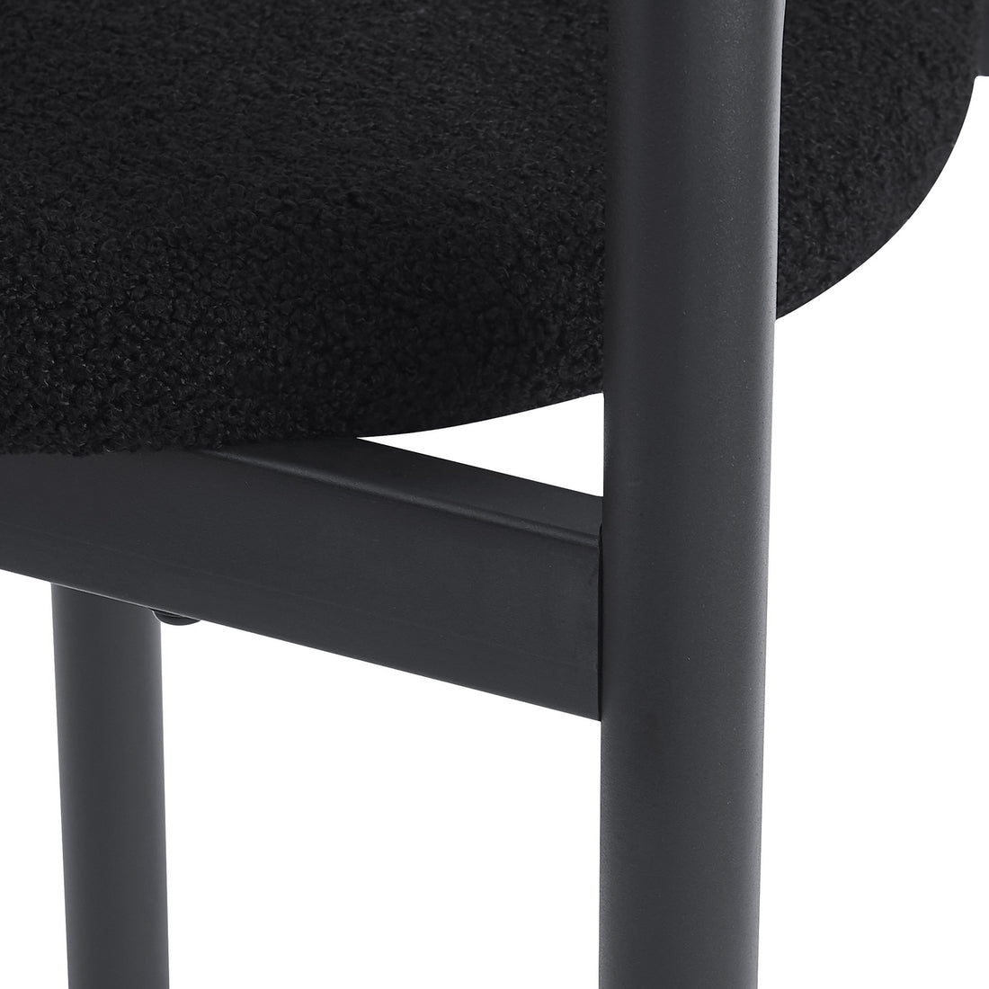 Close-up of a black chair seat and metal frame on a white background
