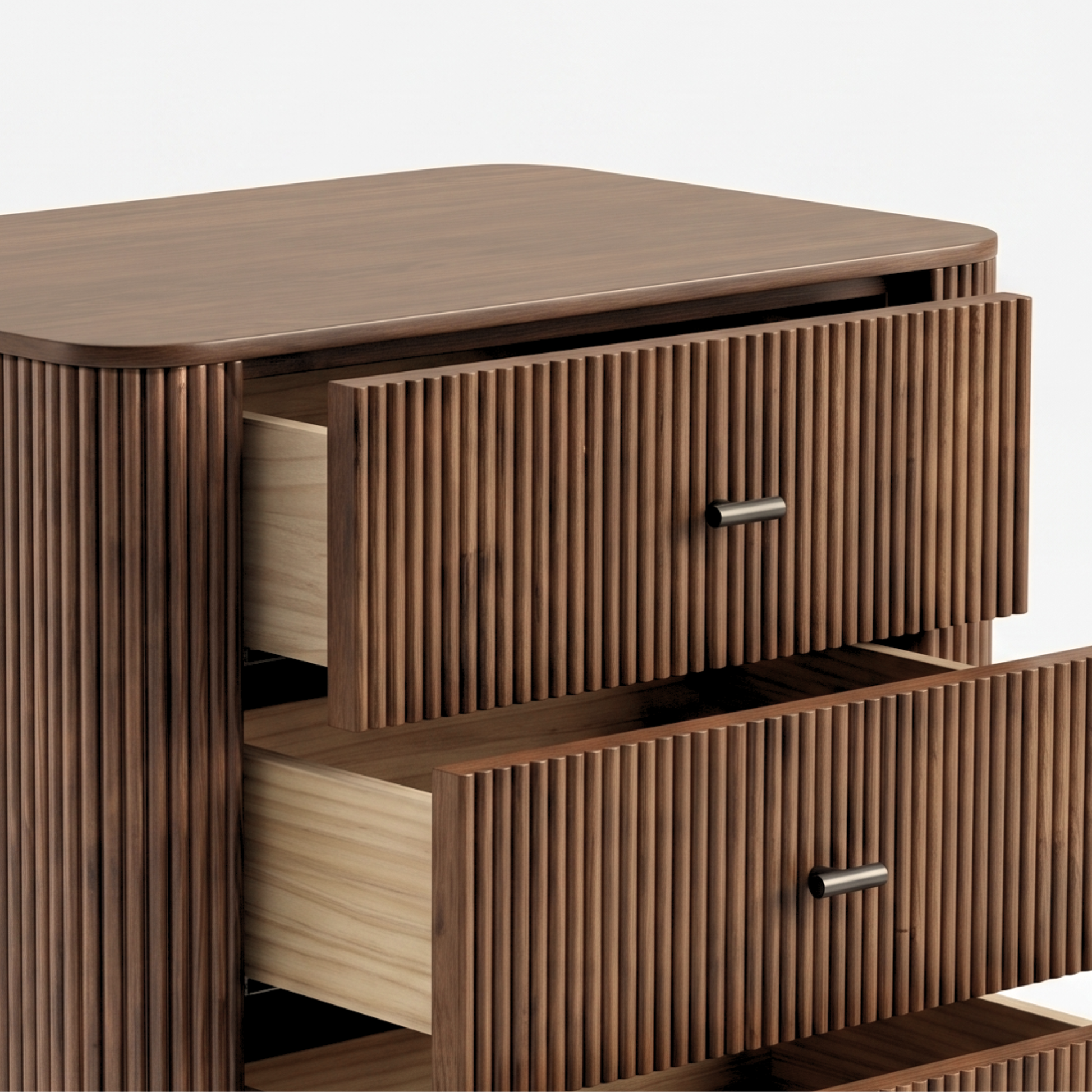Partial close-up of a wooden dresser with fluted drawer fronts on a white background