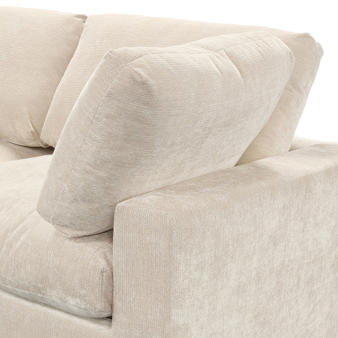 Close-up of beige sofa cushions and armrest on a white background